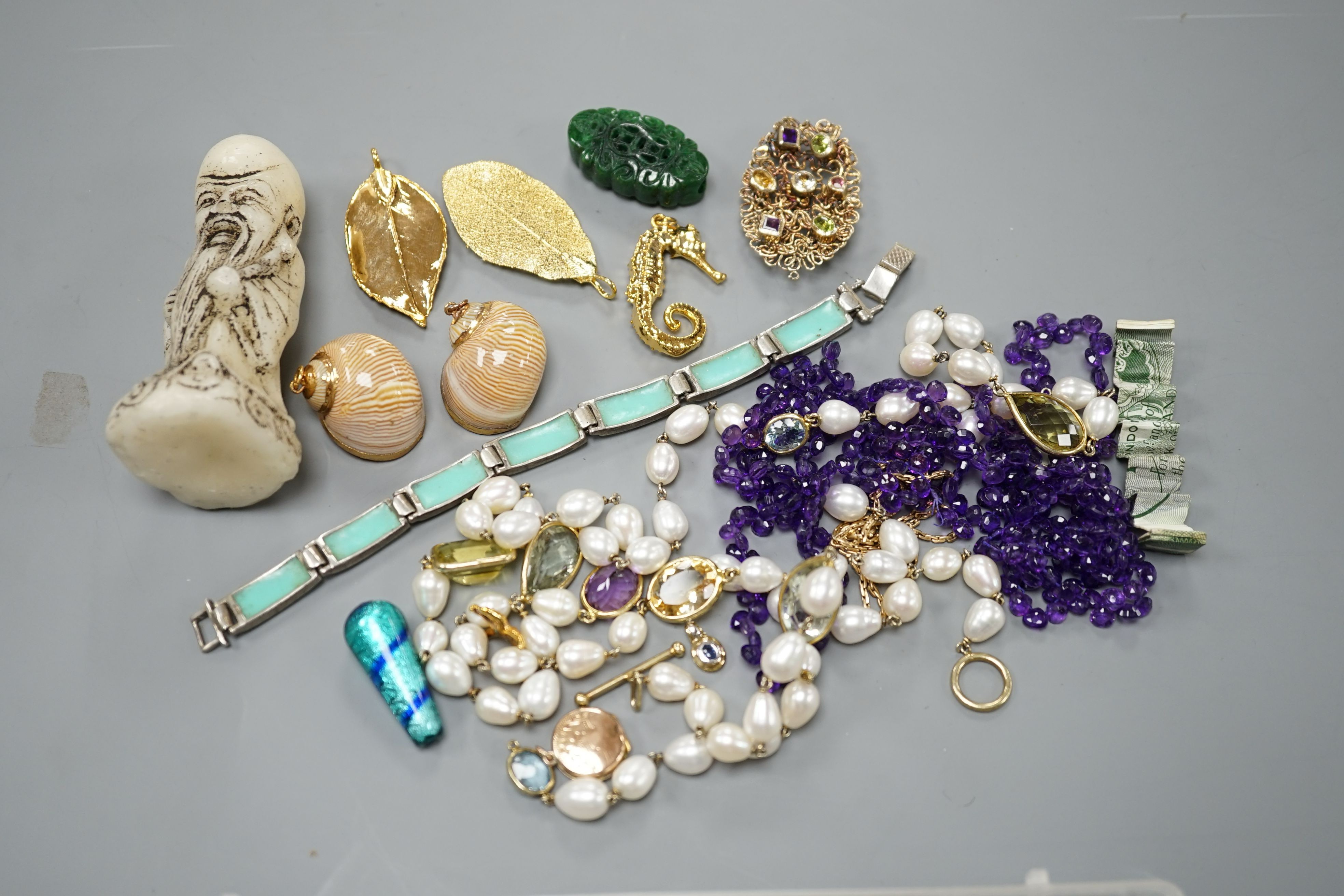 A group of minor costume jewellery including an amethyst bead necklace